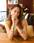 Model wearing gold oval amethyst ring