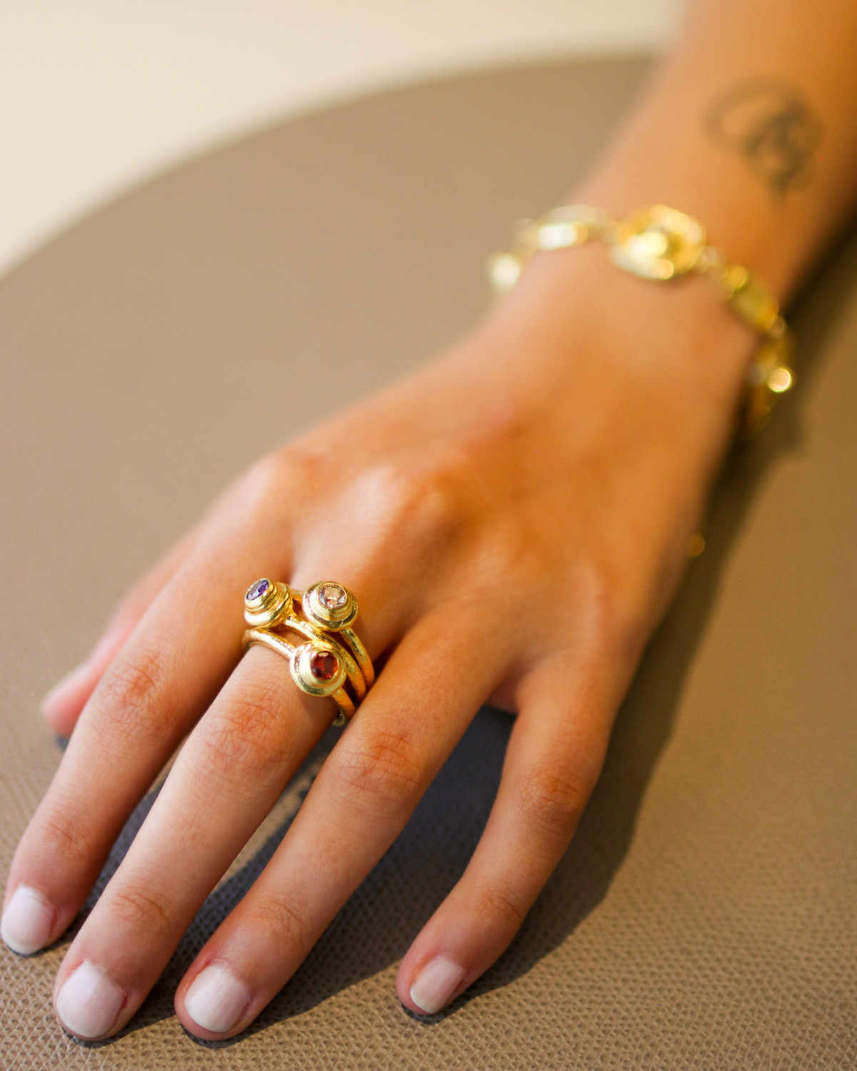 Gold champagne gemstone ring worn on hand