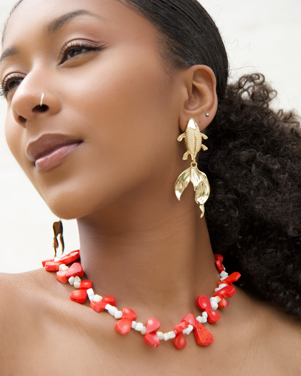 Model wearing chrysoprase chili pepper necklace