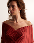 Woman wearing elegant pearl drop earrings