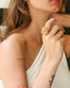 Model wearing gemstone bouquet statement ring