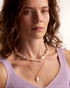 Minimal pearl necklace styled on model