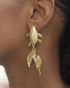 Close-up of koi fish earrings with textured details