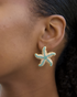 Model wearing turquoise starfish earrings