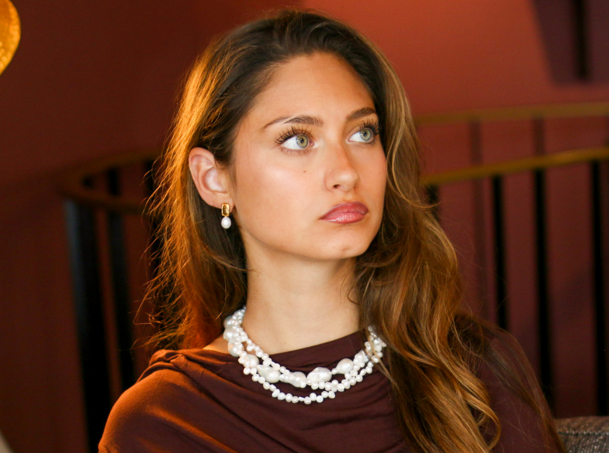 Woman styling Baroque pearl statement earrings