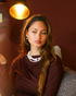 Portrait of woman wearing Baroque freshwater pearl gold earrings