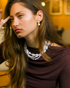 Lifestyle image of Baroque pearl earrings with warm evening lighting
