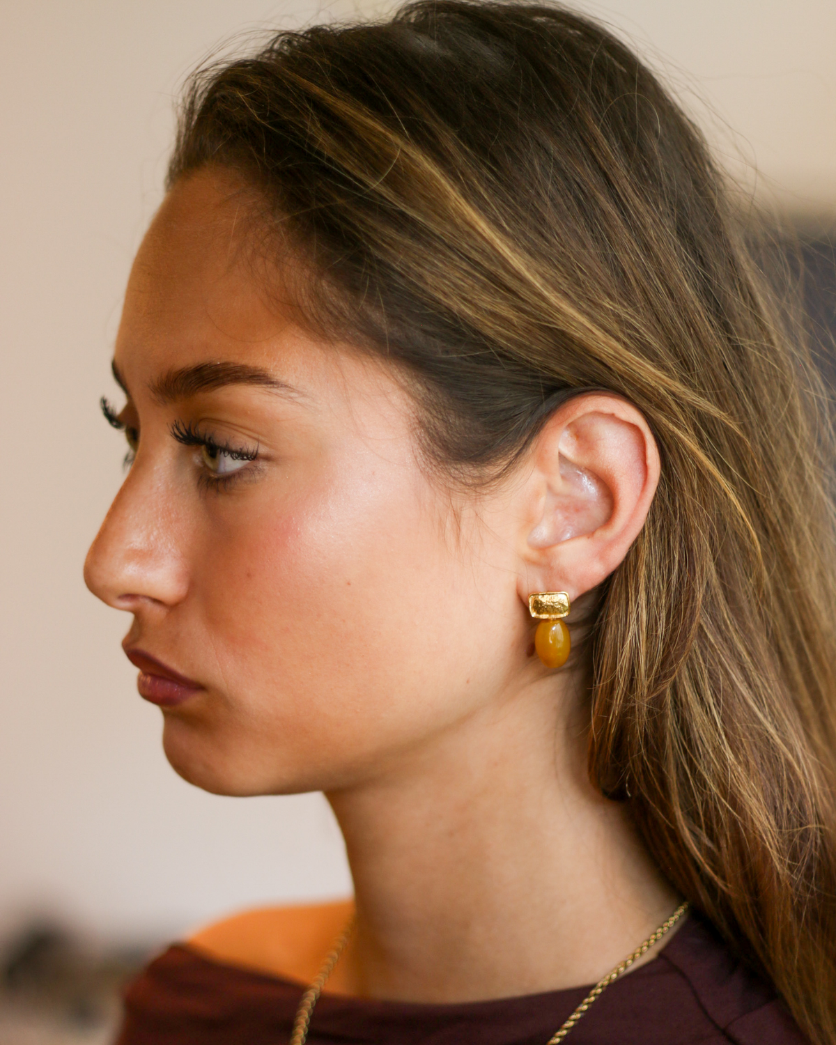 Elegant yellow stone earrings side profile