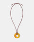 Golden agate donut pendant necklace on adjustable burgundy cord