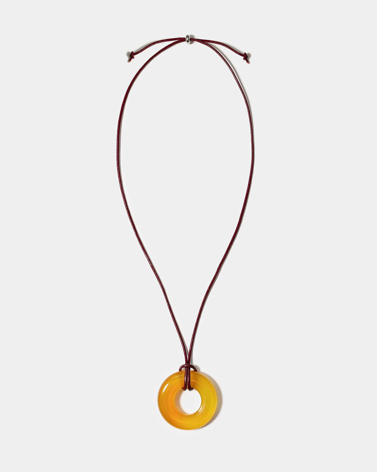 Golden agate donut pendant necklace on adjustable burgundy cord