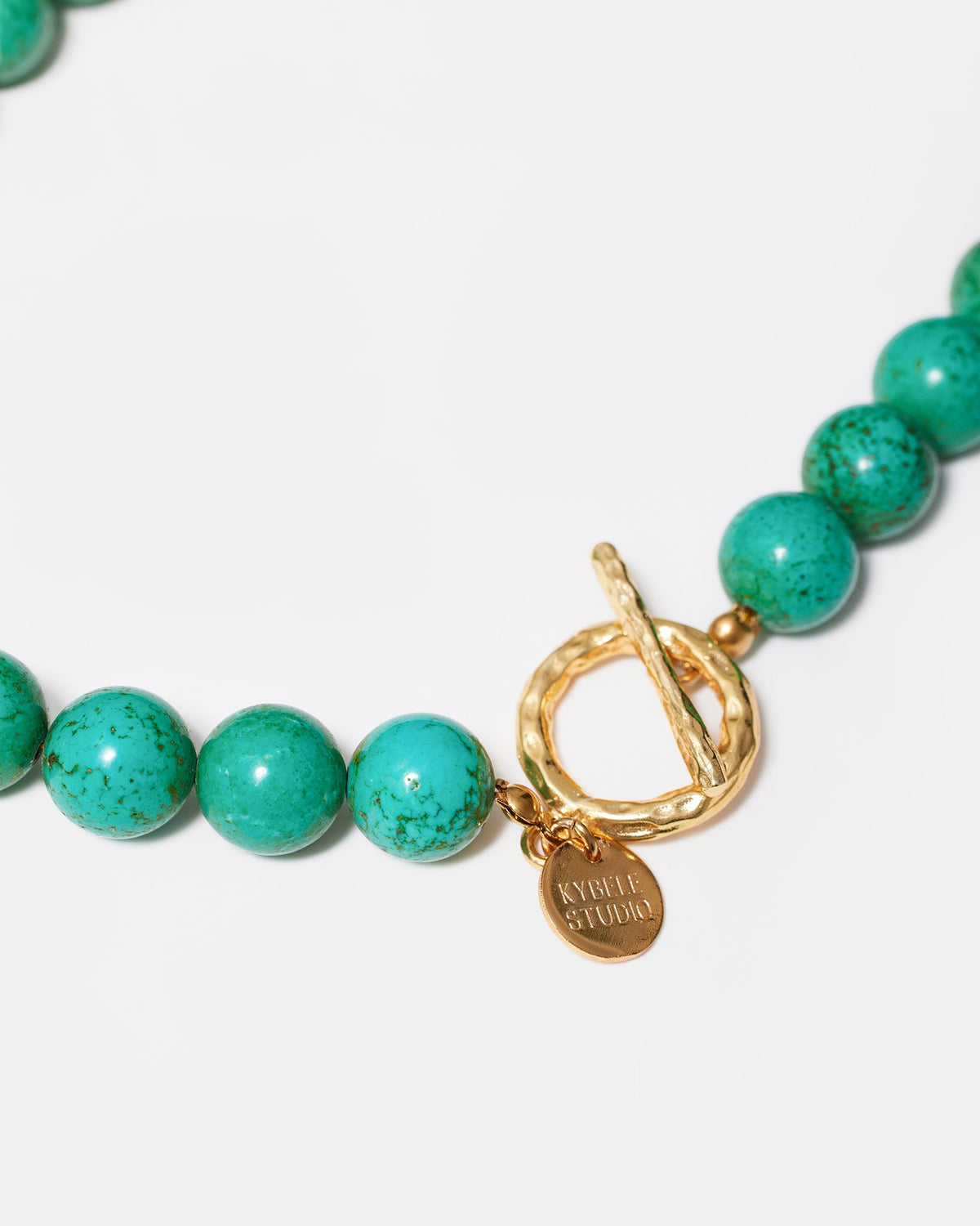 Turquoise gemstone necklace with gold-tone clasp detail