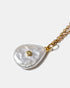 Close-up of pearl pendant necklace