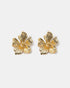 Textured flower stud earrings close-up