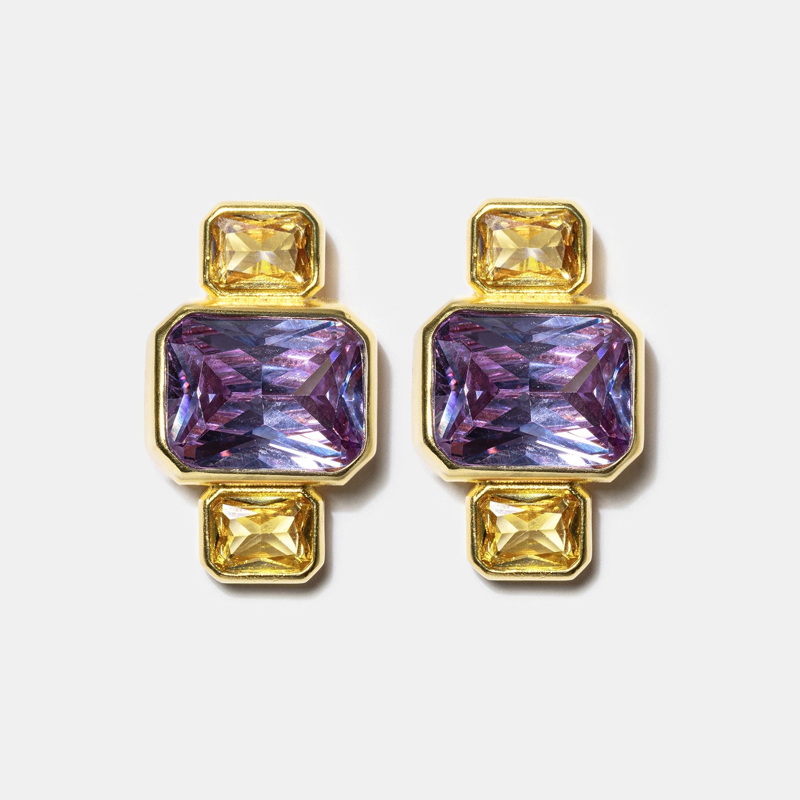 Gold geometric stud earrings with blue gemstones