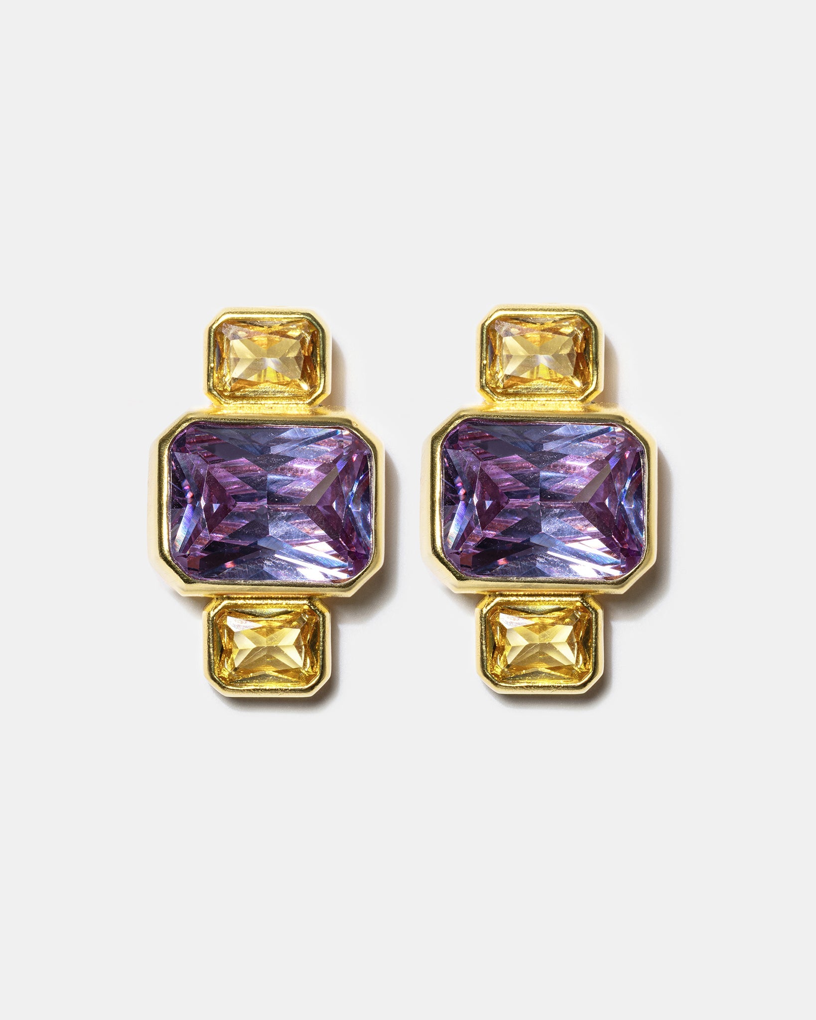 Gold geometric stud earrings with blue gemstones