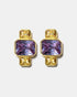 Gold geometric stud earrings with blue gemstones