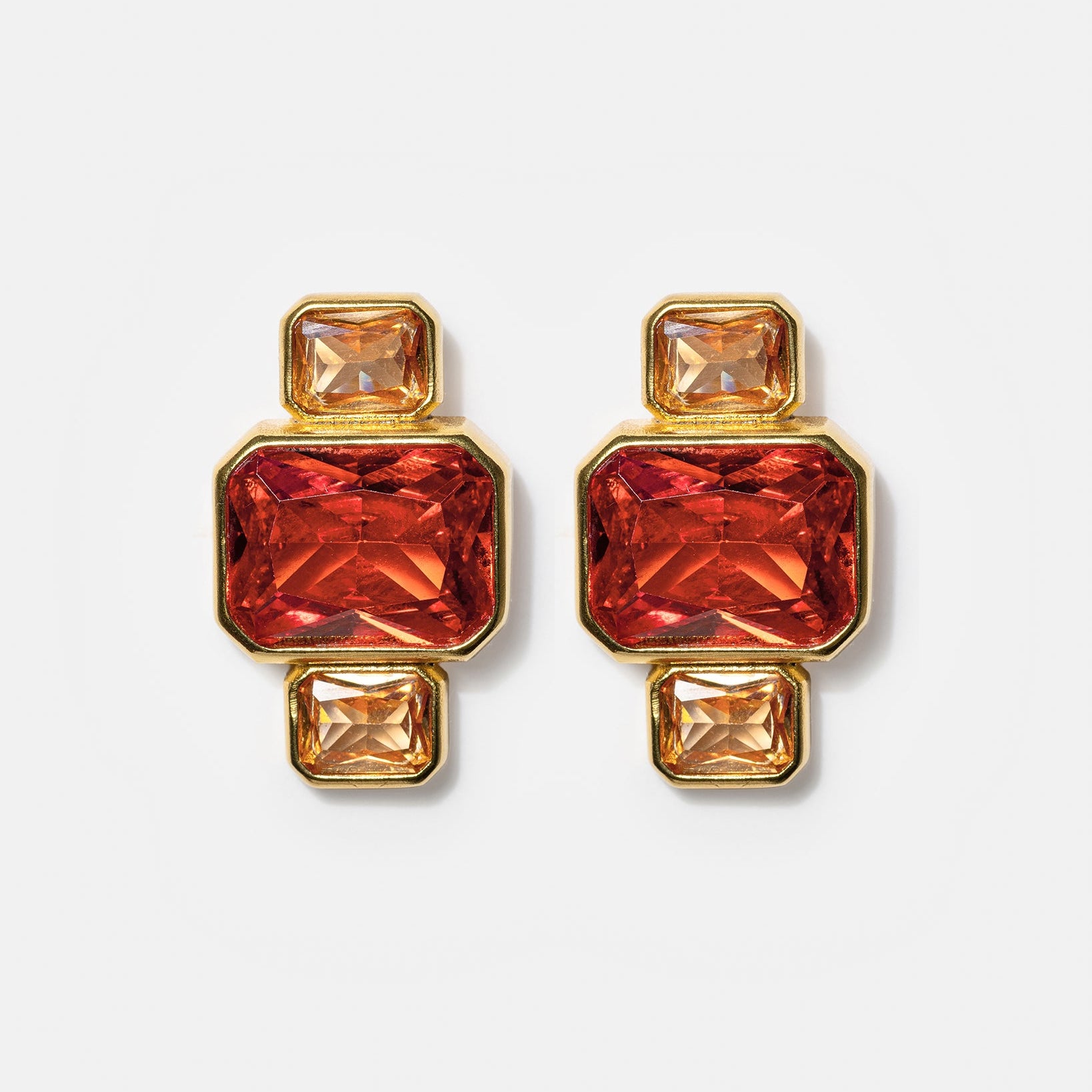 Gold geometric stud earrings with pink and amber gemstones