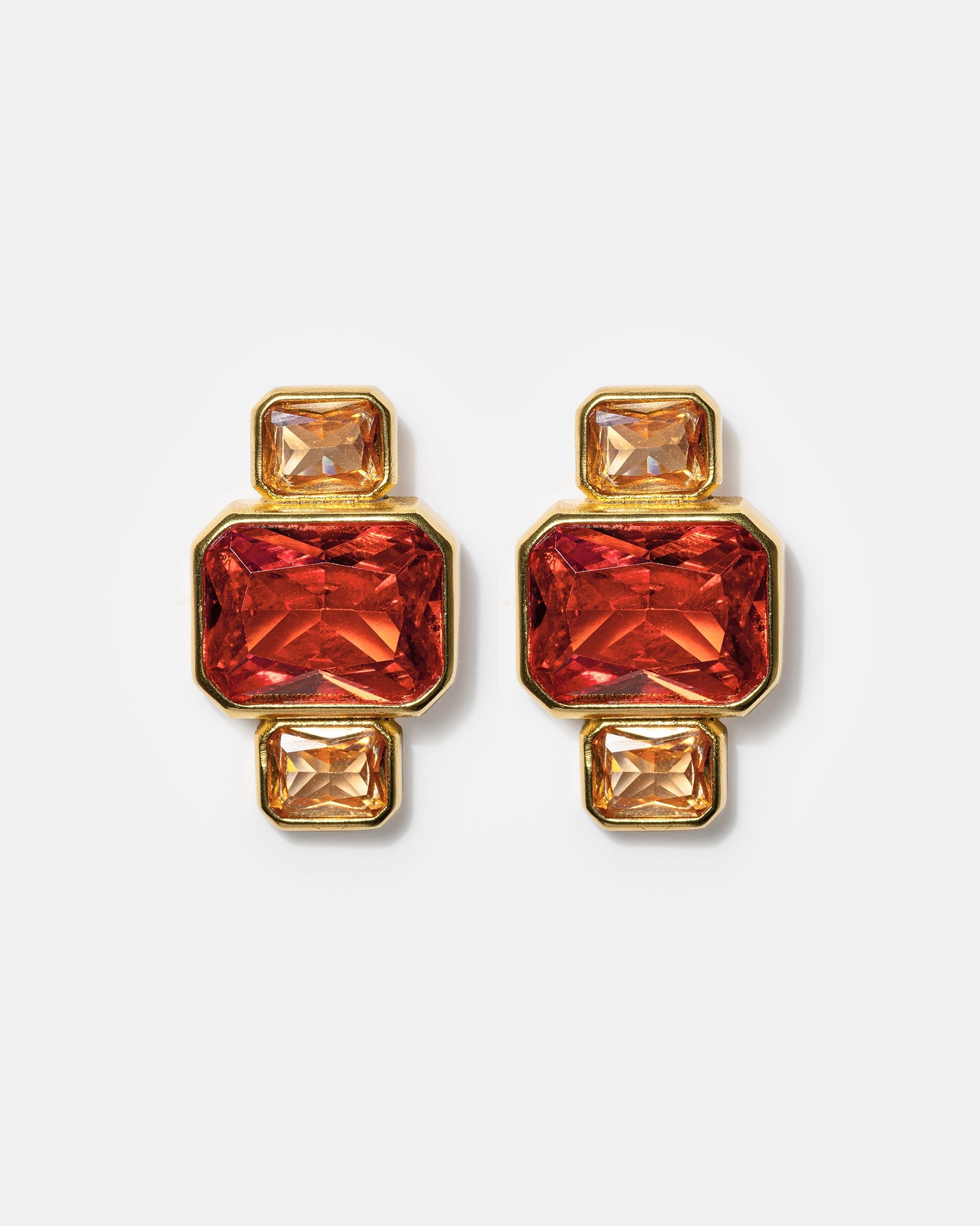 Gold geometric stud earrings with pink and amber gemstones