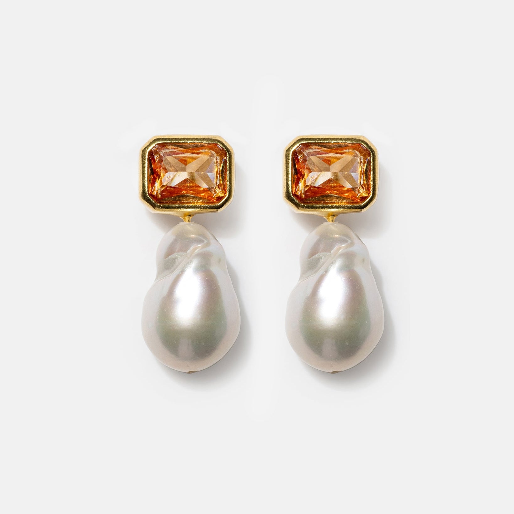 Gold pearl drop earrings with champagne gemstones