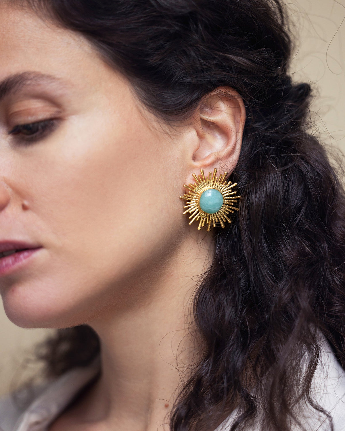 Woman wearing Celestial Radiance aventurine earrings with an elegant celestial look