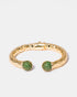 Gold-plated bangle bracelet with green zircon stone accents