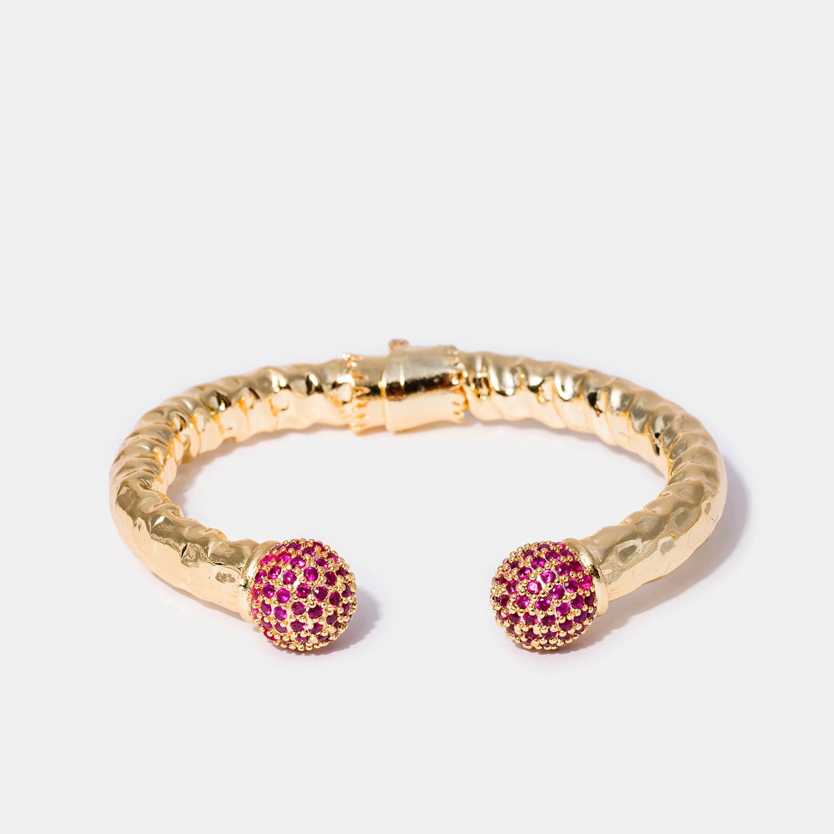 Selene gold cuff bracelet with fuchsia gemstone details