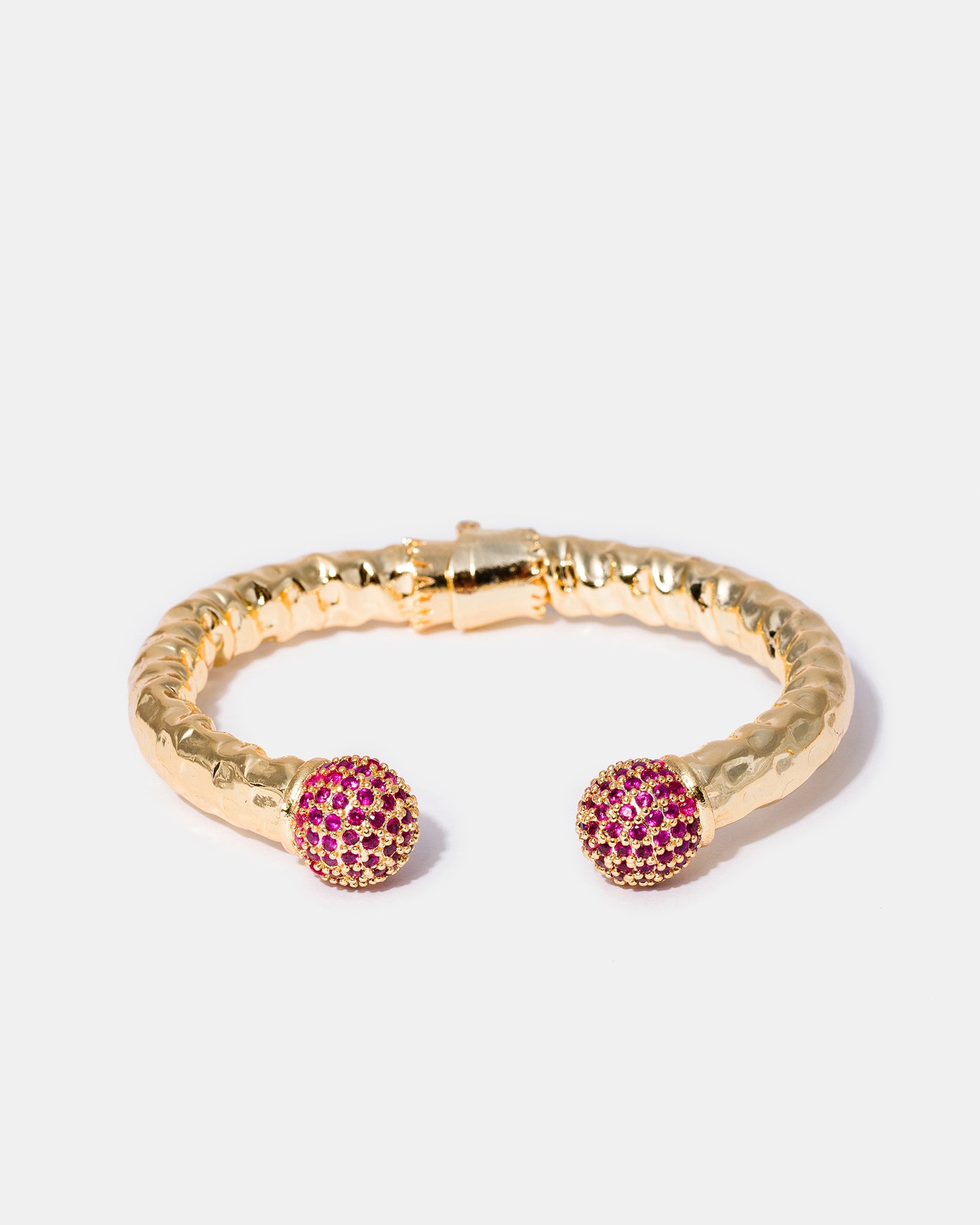 Selene gold cuff bracelet with fuchsia gemstone details