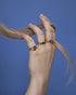 Woman wearing Celestial Glow ring with vibrant zircon details and modern styling