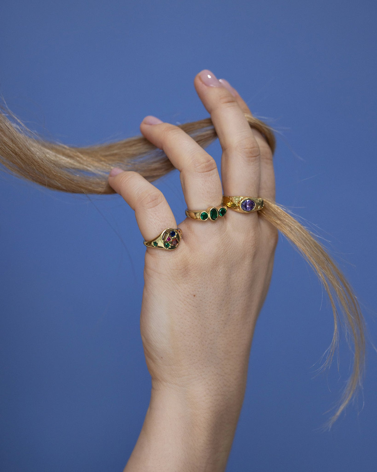 Woman wearing Celestial Burst statement ring with vibrant gemstone details