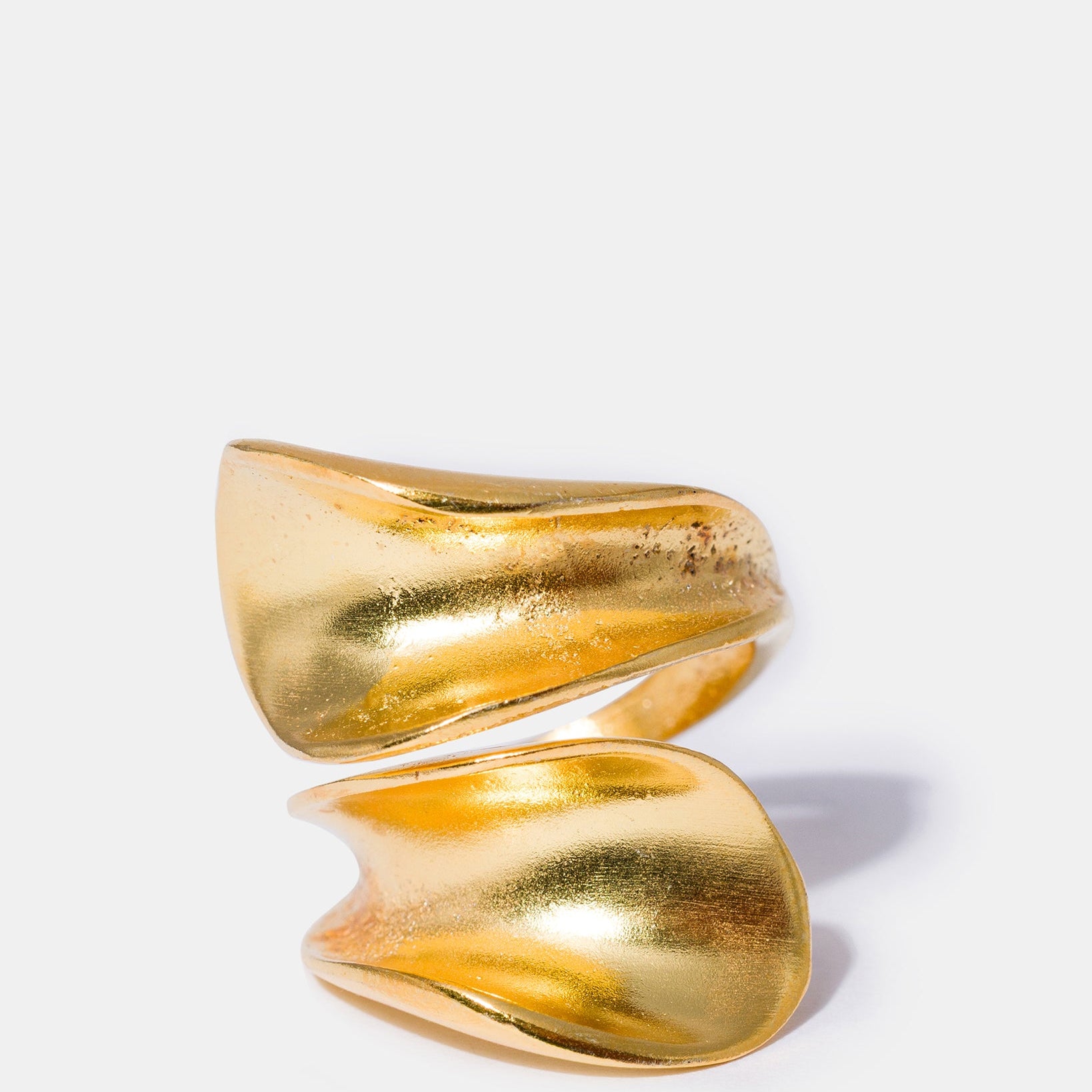 Gold sculptural wrap ring with fluid organic design