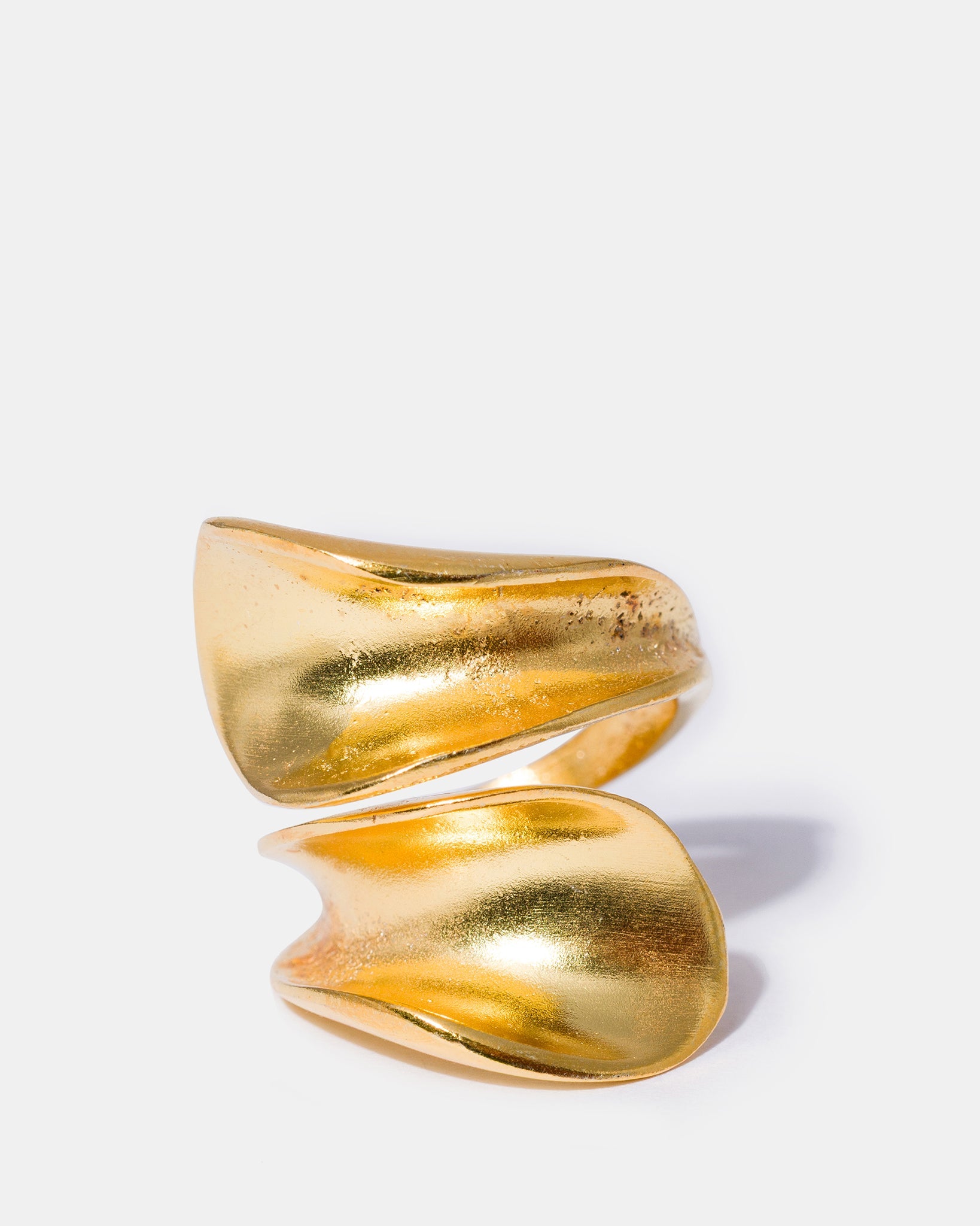 Gold sculptural wrap ring with fluid organic design