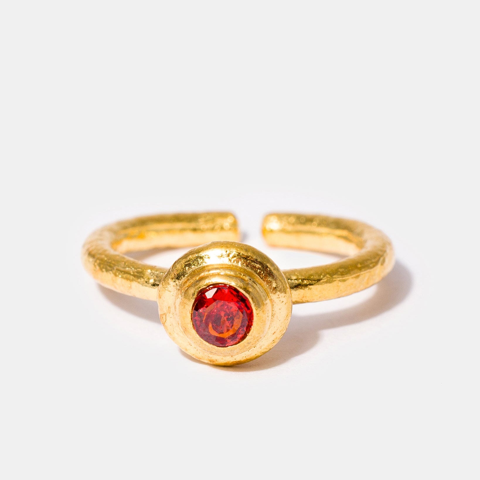 Gold gemstone ring with amber colored cubic zirconia