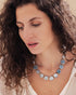 Close-up detail of hexagonal aquamarine beads and gold-plated accents