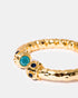 Close-up of gold bangle with sparkling zircon stone details