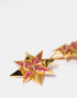 Gold star-shaped earrings close-up