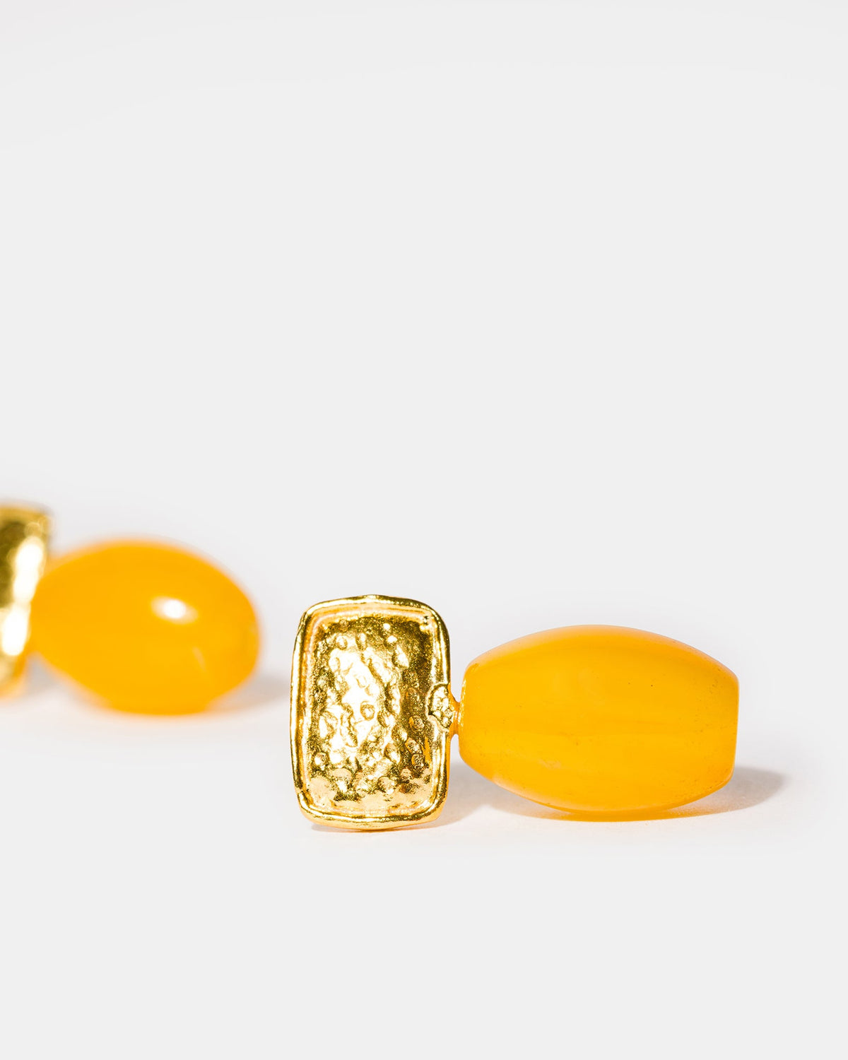 Oval yellow gemstone earrings close-up