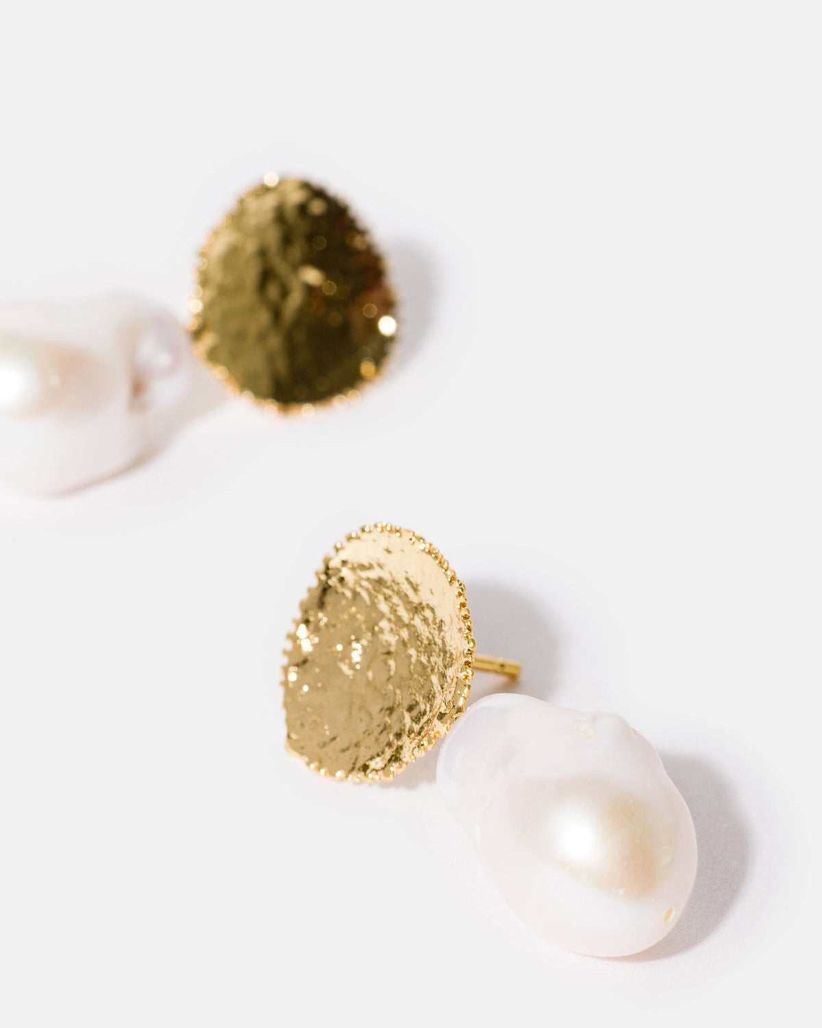 Organic pearl drop earrings close-up