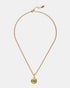 Full-length gold necklace with emerald medallion pendant