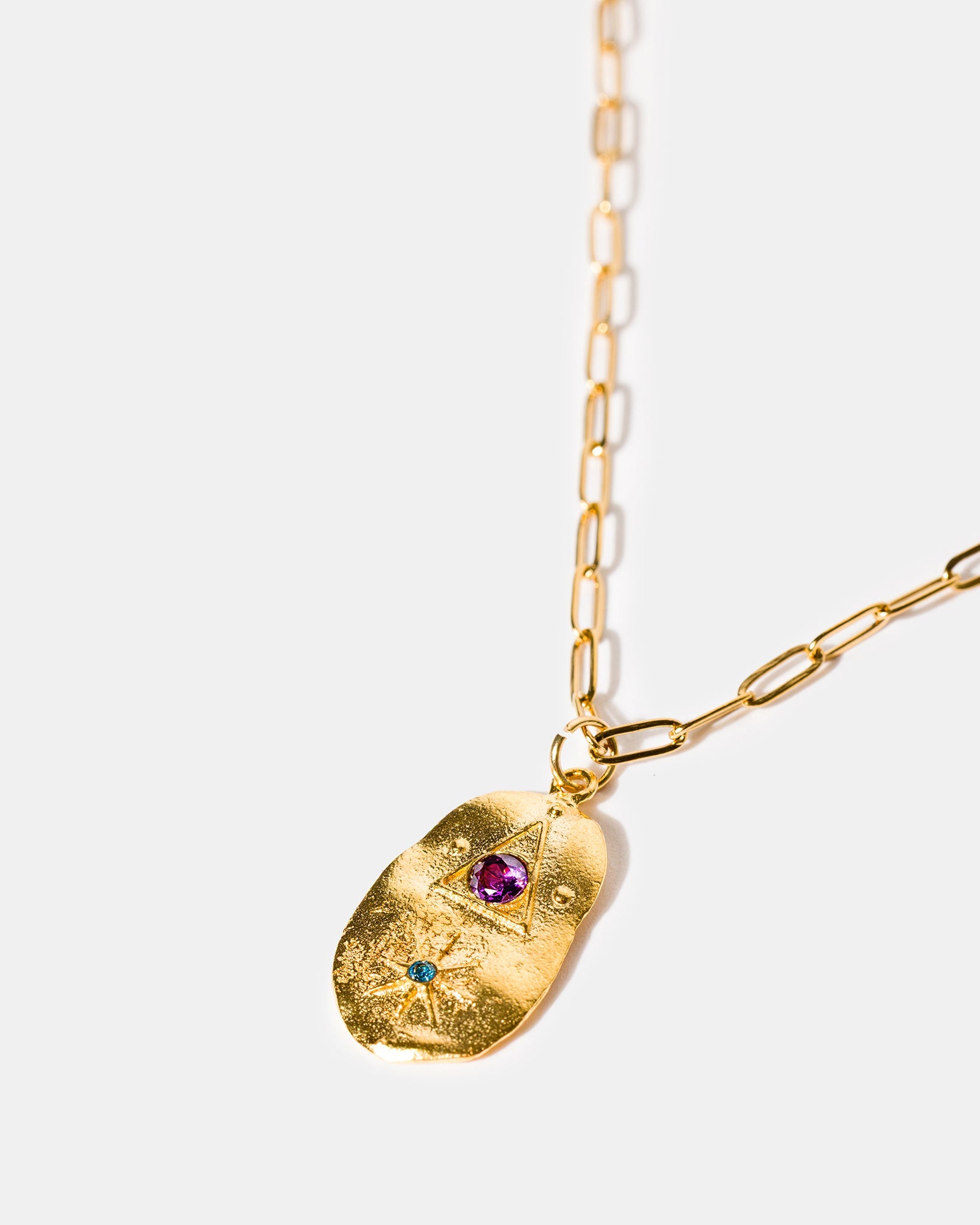 Gold talisman necklace with amethyst and blue stones