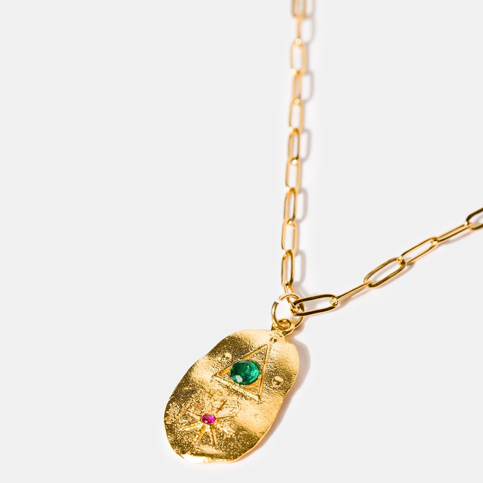 Gold talisman necklace with ruby and green stones