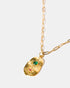 Gold talisman necklace with ruby and green stones