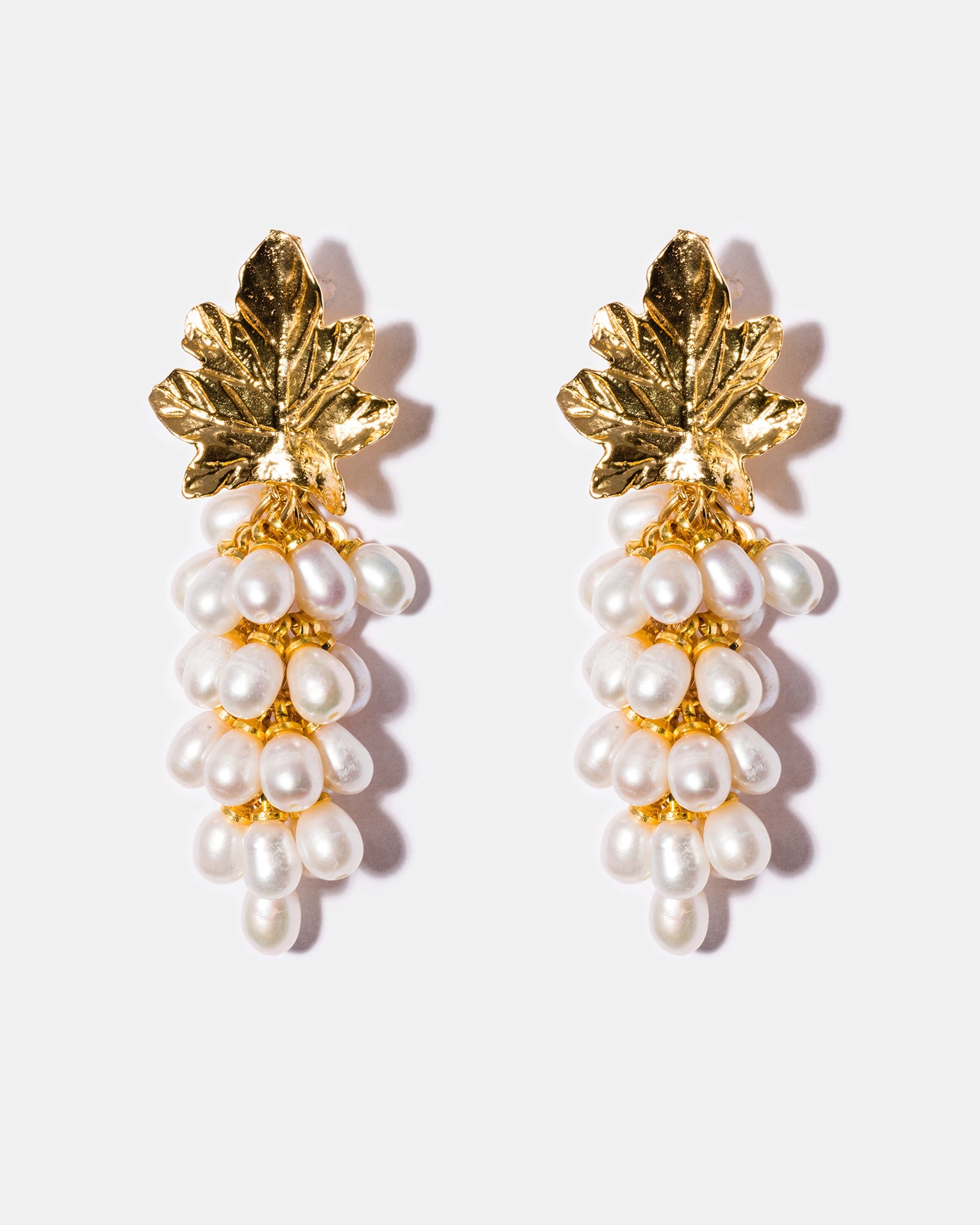 Freshwater pearl cluster earrings with textured gold leaf design and 18k gold-plated brass