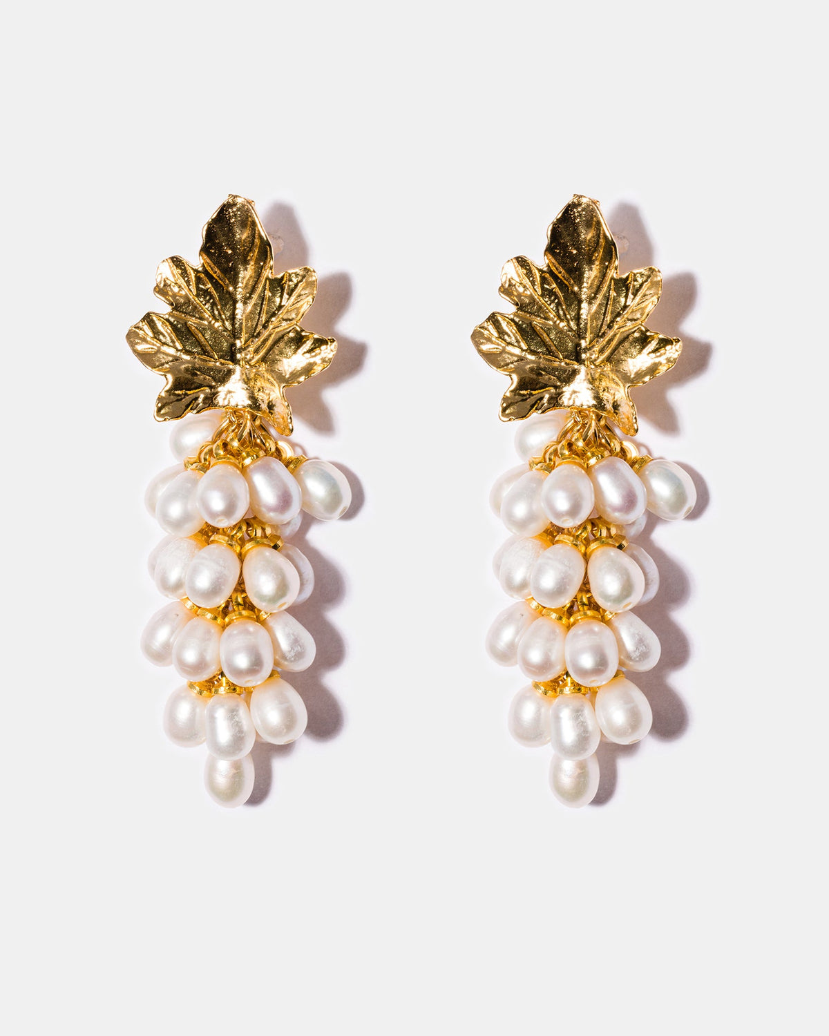 Freshwater pearl cluster earrings with textured gold leaf design and 18k gold-plated brass