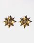 Sapphire starburst earrings flatlay