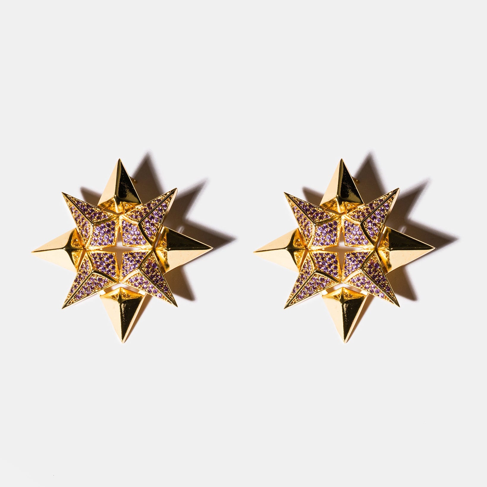 Amethyst starburst earrings flatlay