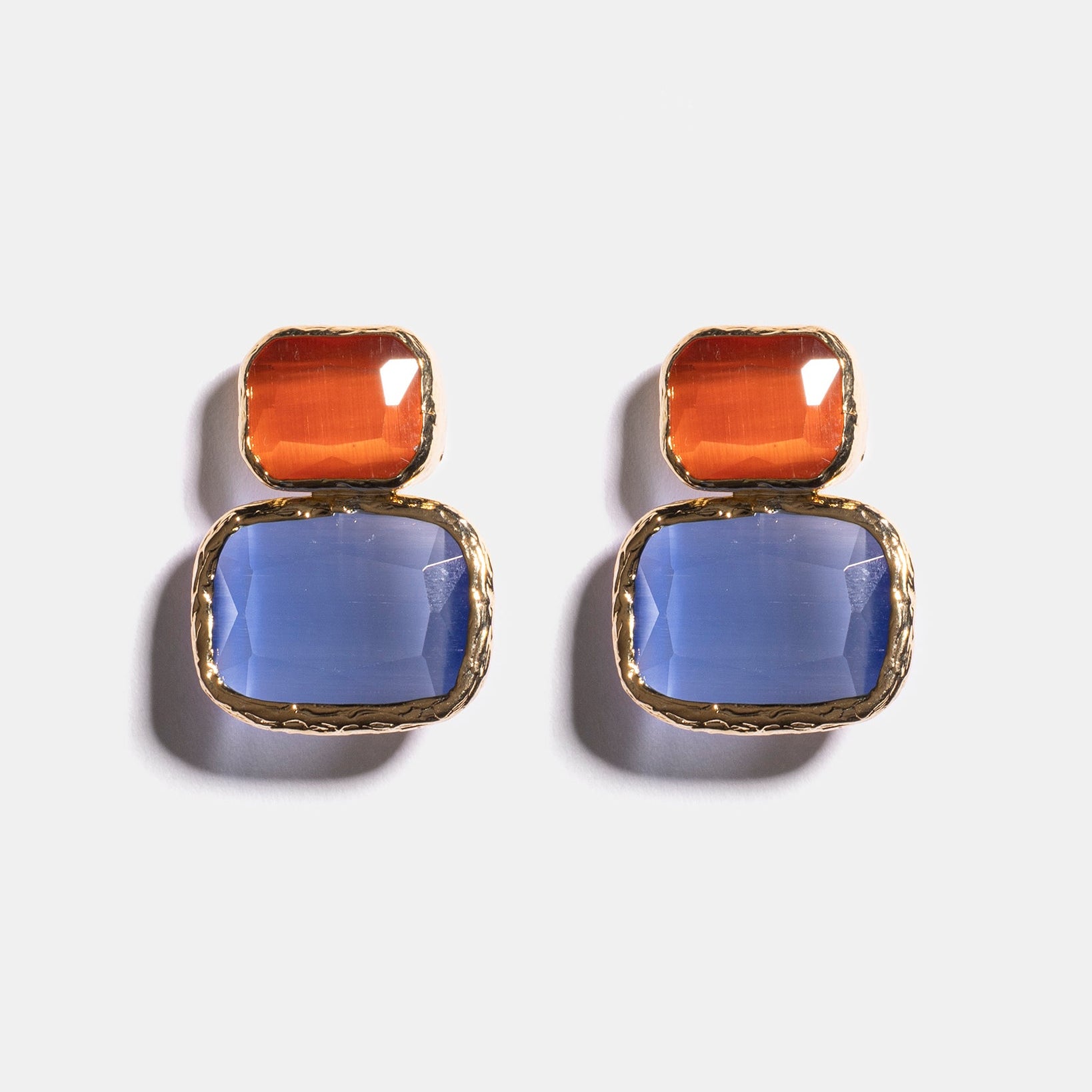 Amber and blue Cat’s Eye earrings flatlay