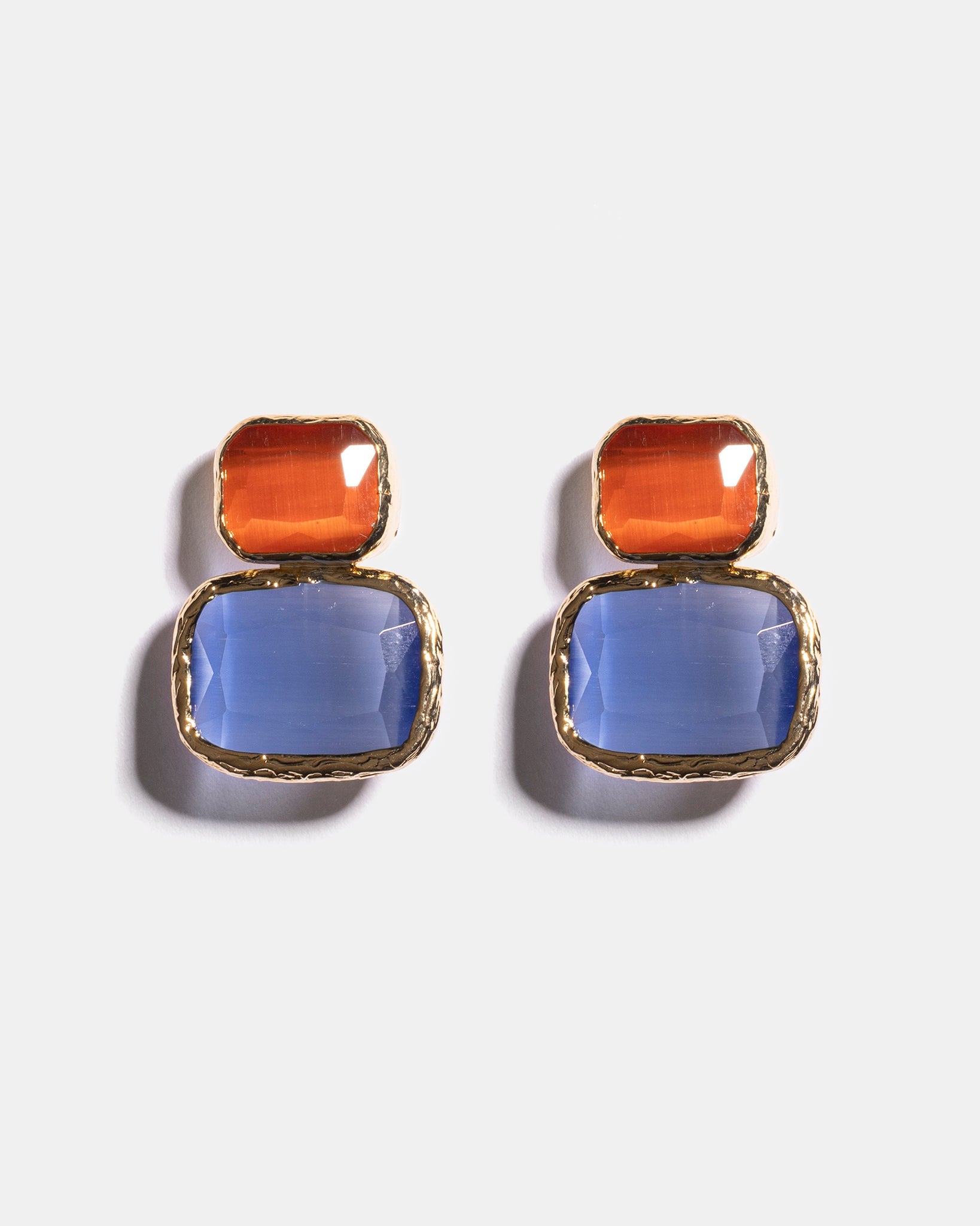 Amber and blue Cat’s Eye earrings flatlay