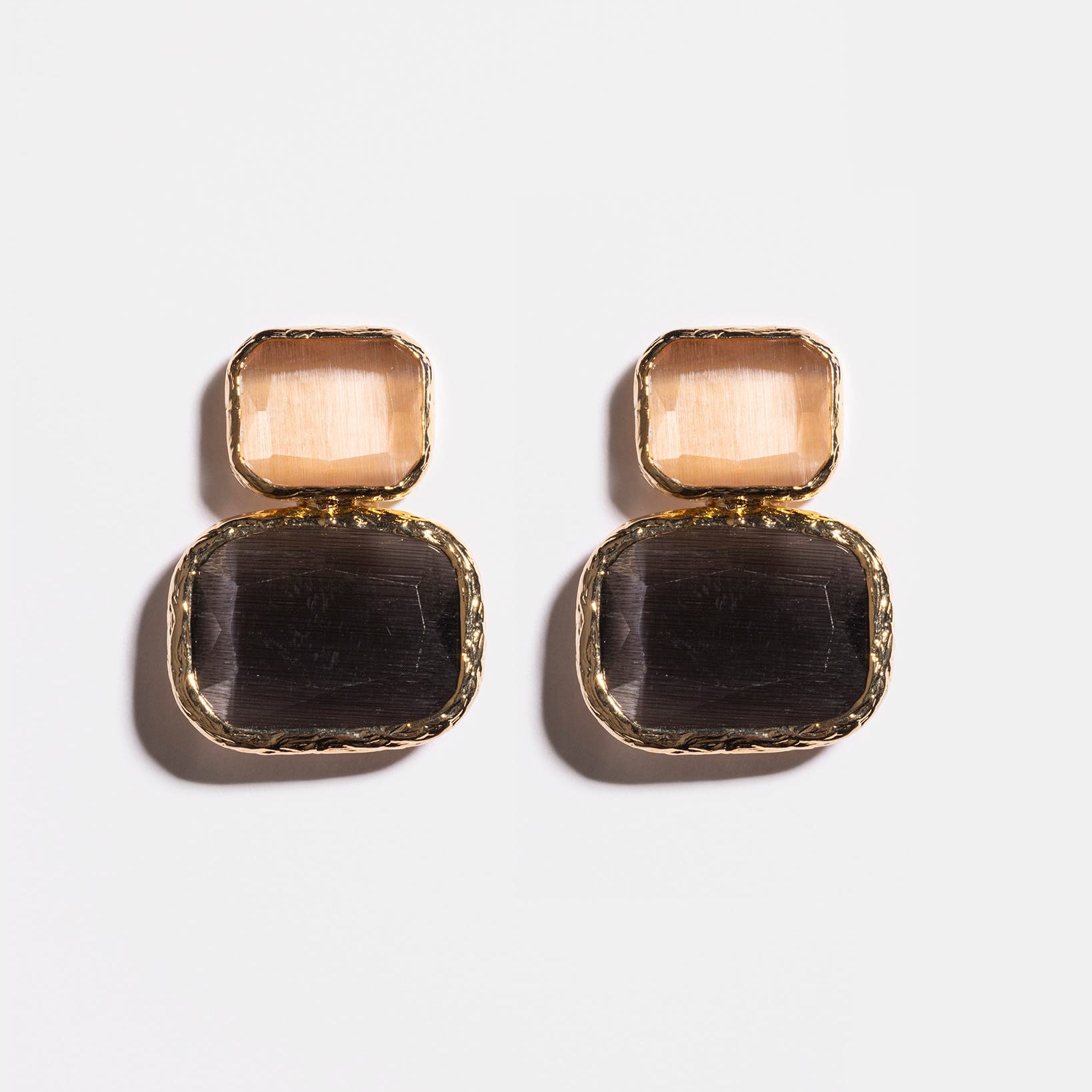 Anthracite and champagne Cat’s Eye earrings flatlay
