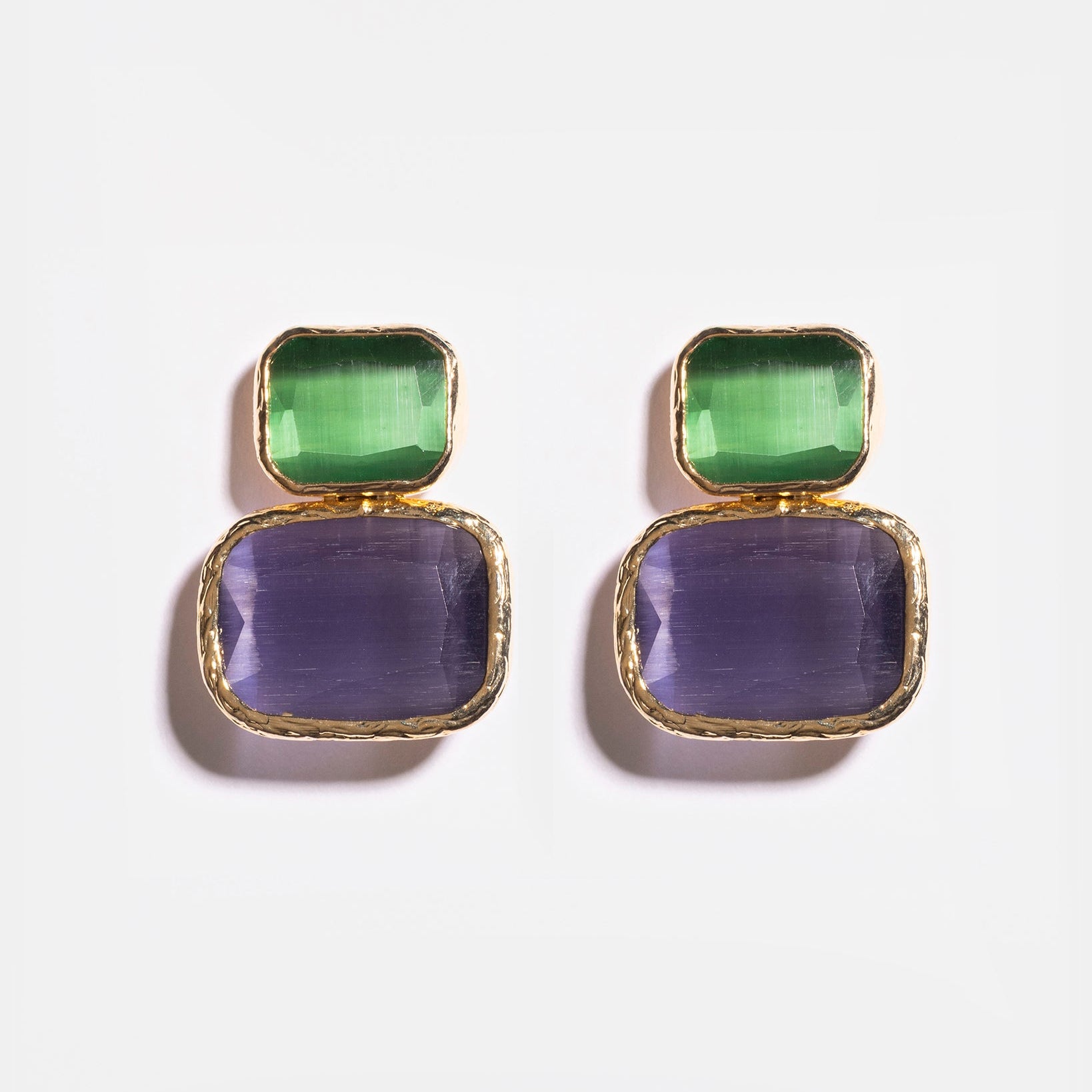 Emerald and purple Cat’s Eye earrings flatlay
