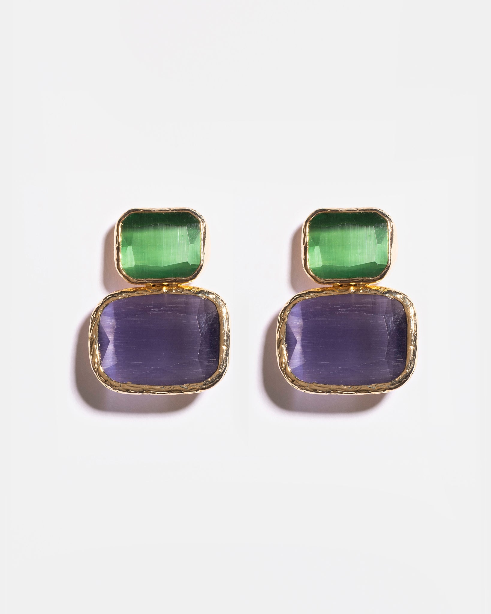 Emerald and purple Cat’s Eye earrings flatlay